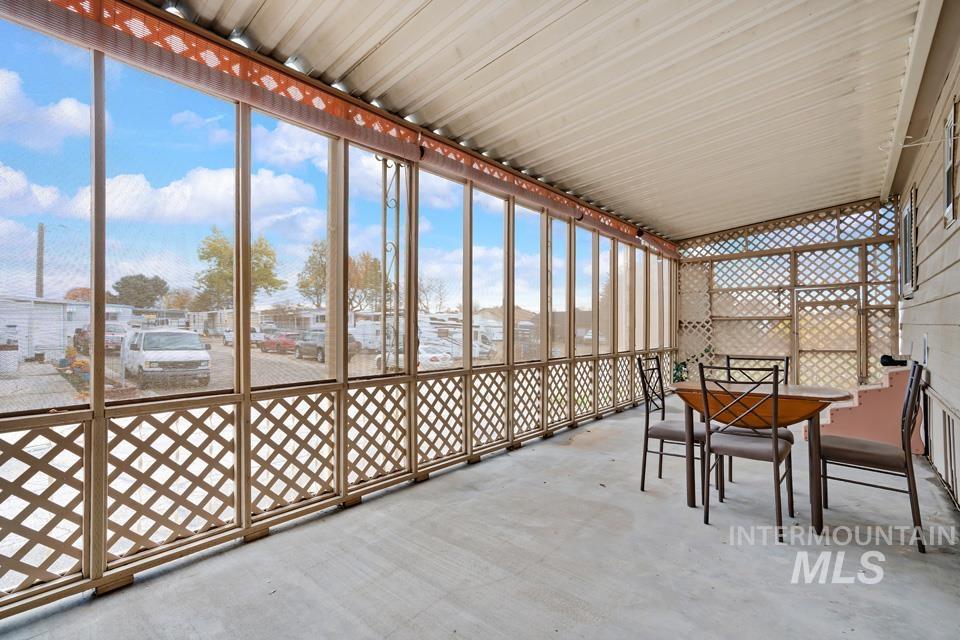 Sunroom / solarium with a residential view