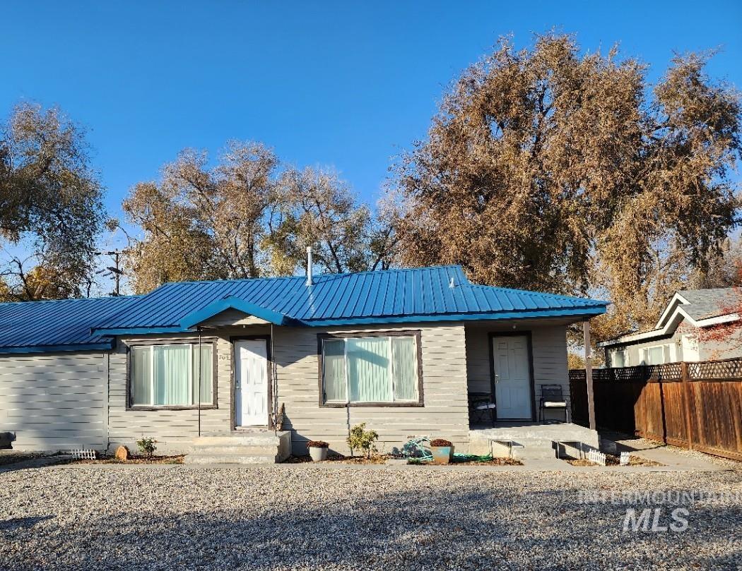 View of front of property with a metal roof
