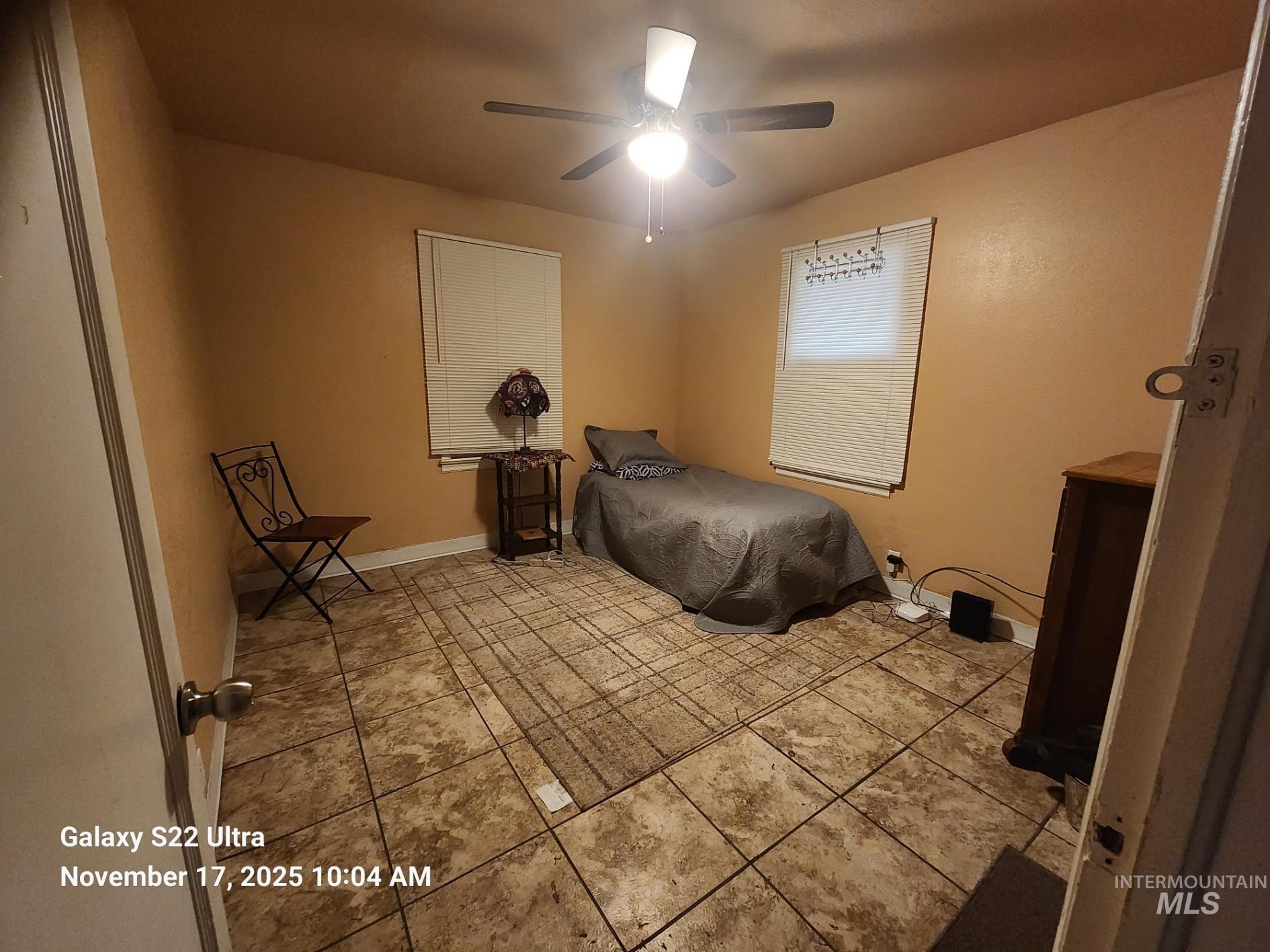 Bedroom featuring ceiling fan and light tile patterned floors