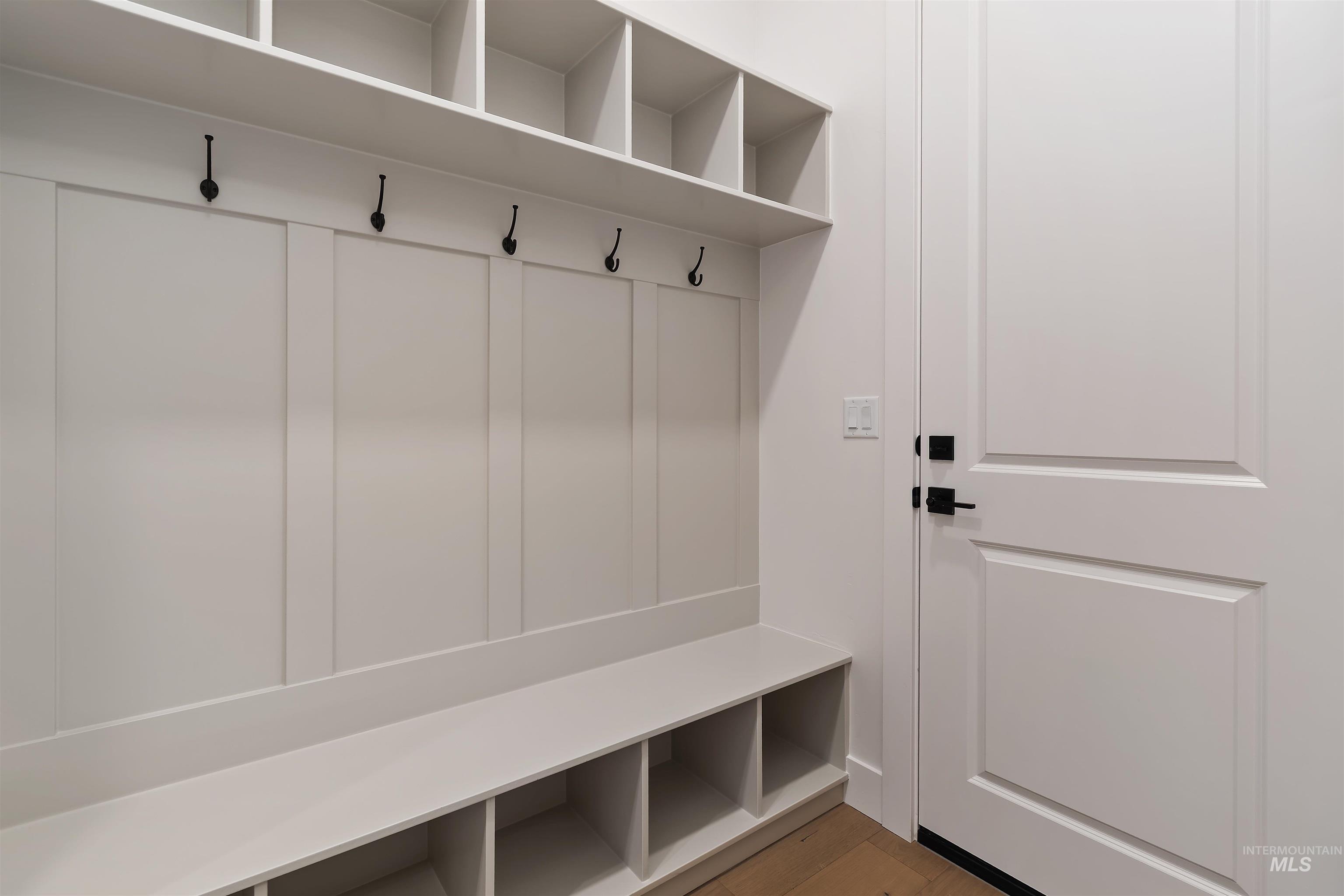 Mudroom with wood finished floors