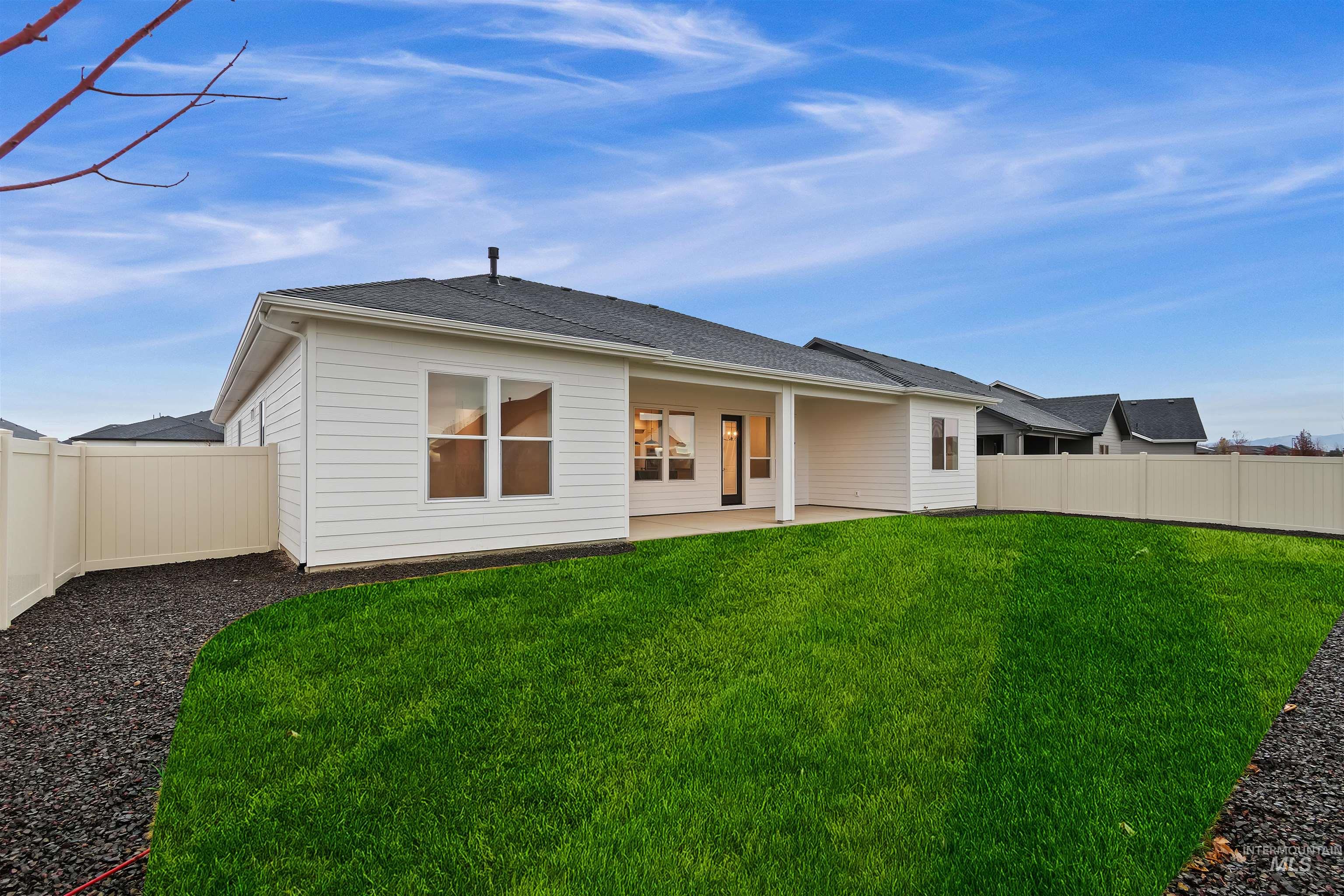 Back of house featuring a fenced backyard and a patio area