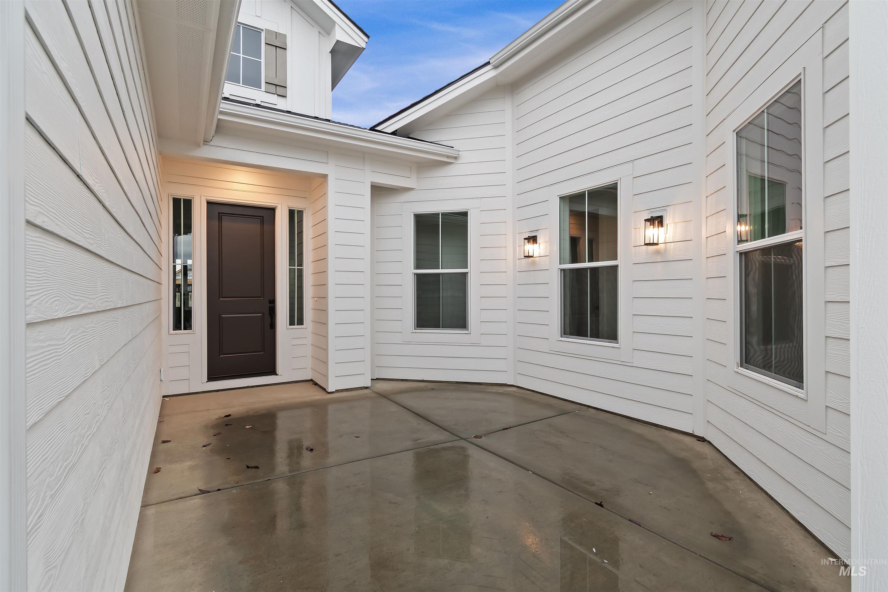 Property entrance featuring a patio