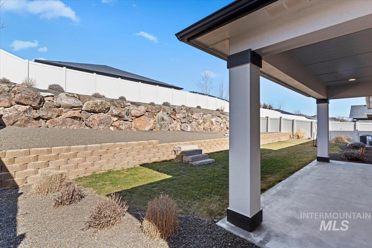 Fenced backyard featuring a patio area