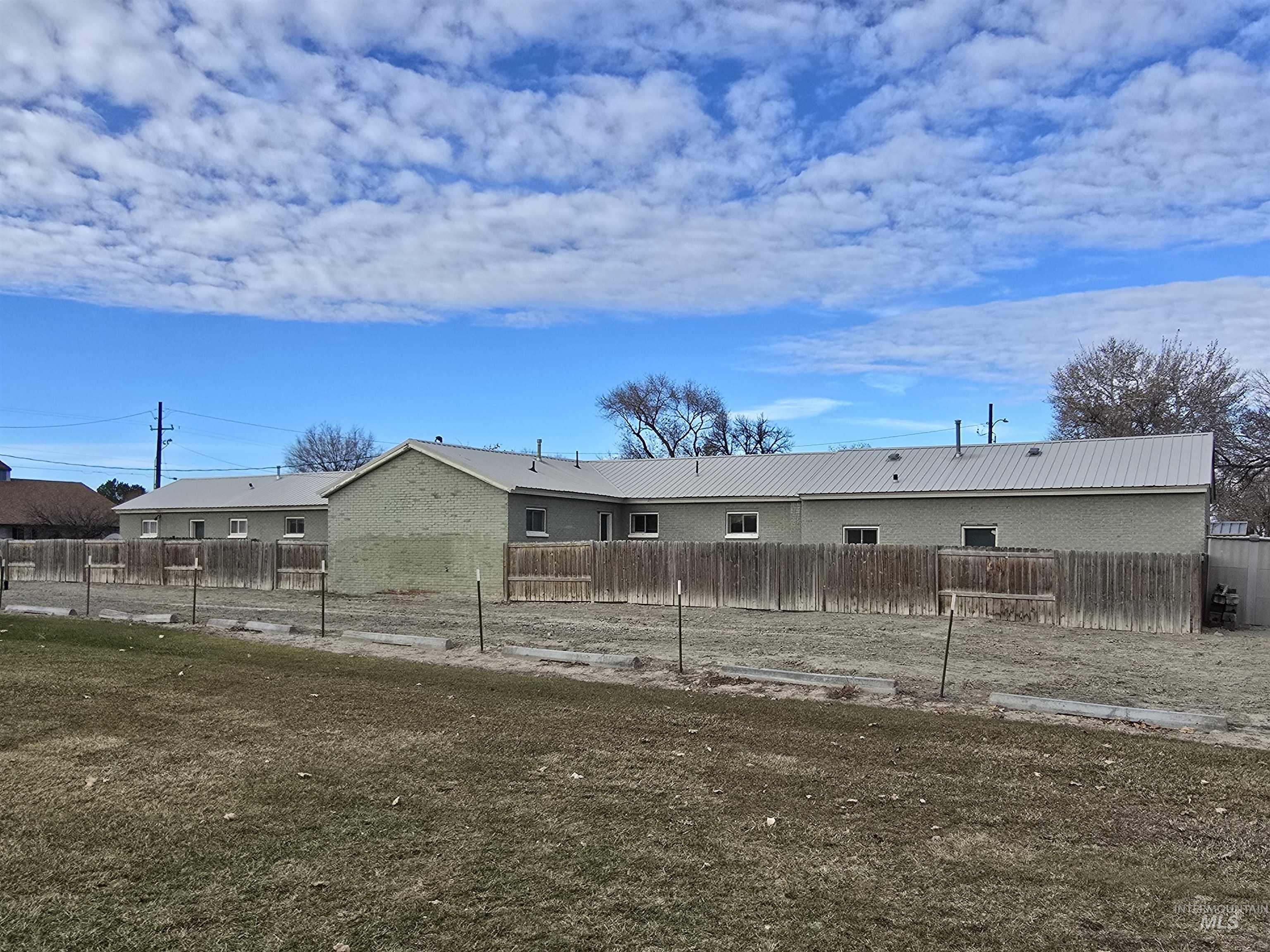 Back of house featuring a metal roof
