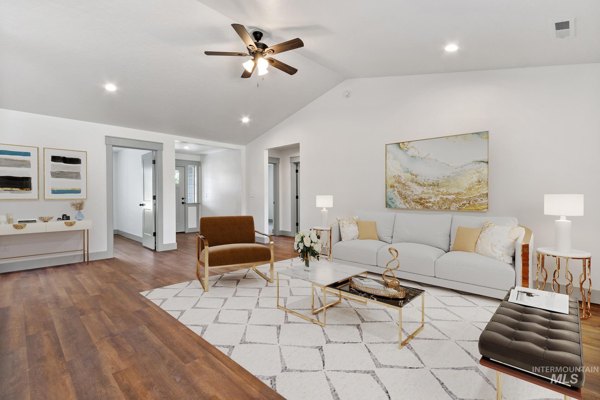 Living area featuring lofted ceiling, wood finished floors, recessed lighting, and ceiling fan