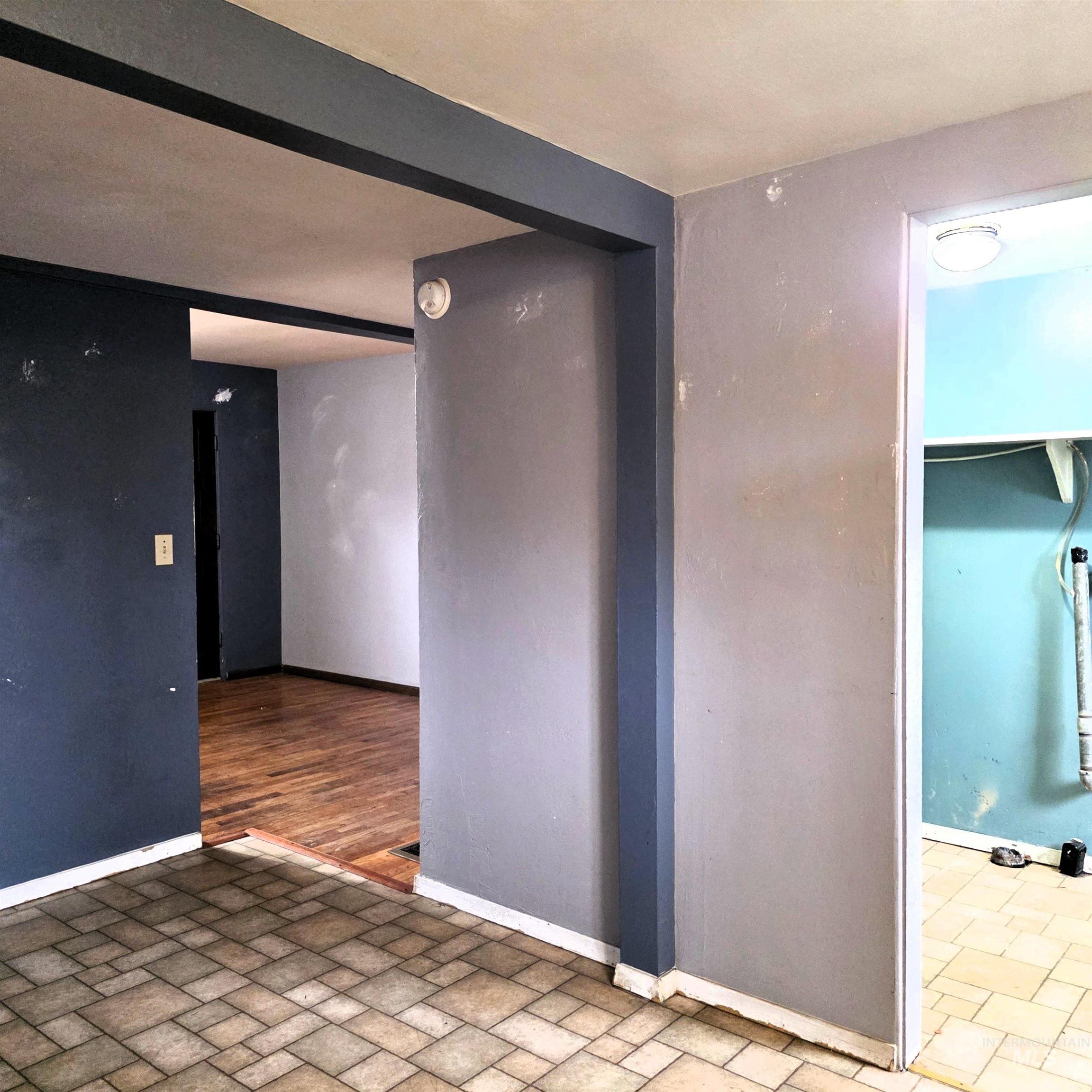 Unfurnished room with baseboards