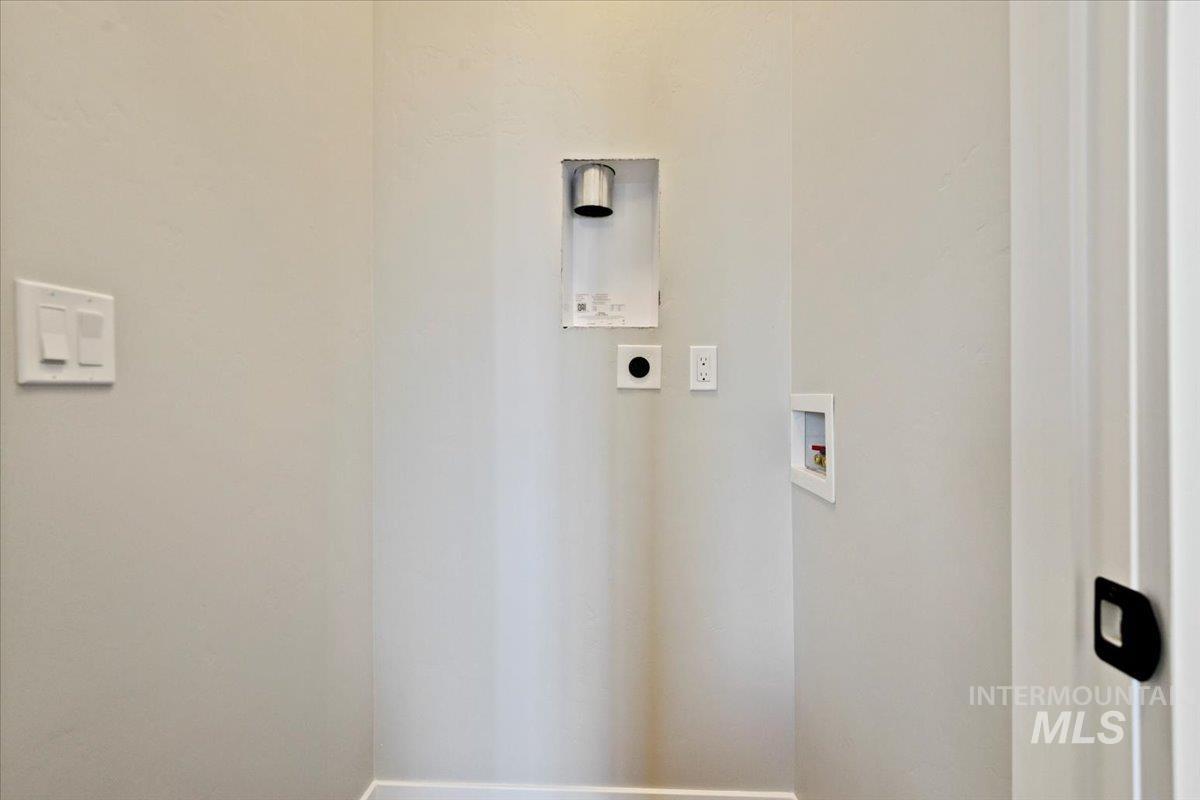 Washroom featuring hookup for an electric dryer and hookup for a washing machine