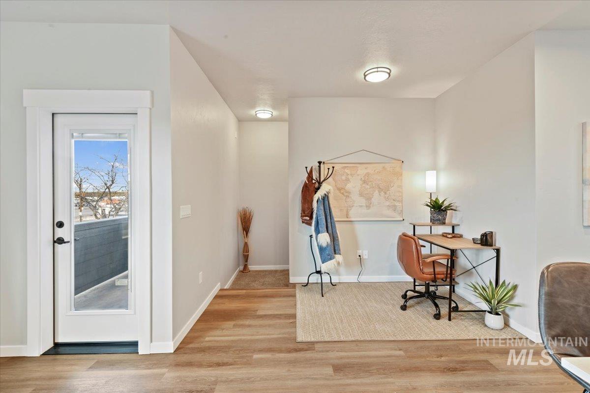 Office featuring light wood-type flooring and baseboards