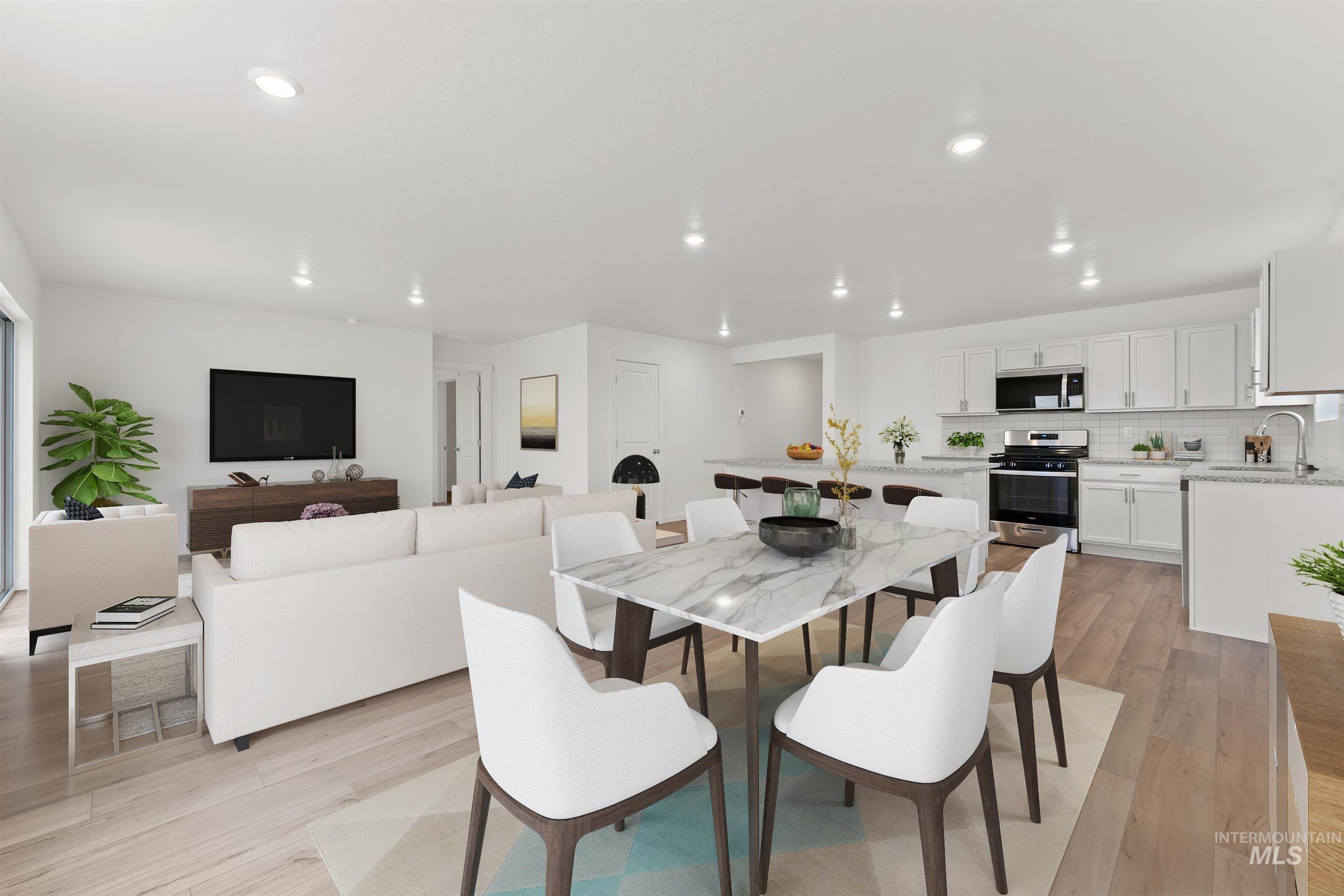 Dining space featuring light wood-style floors and recessed lighting