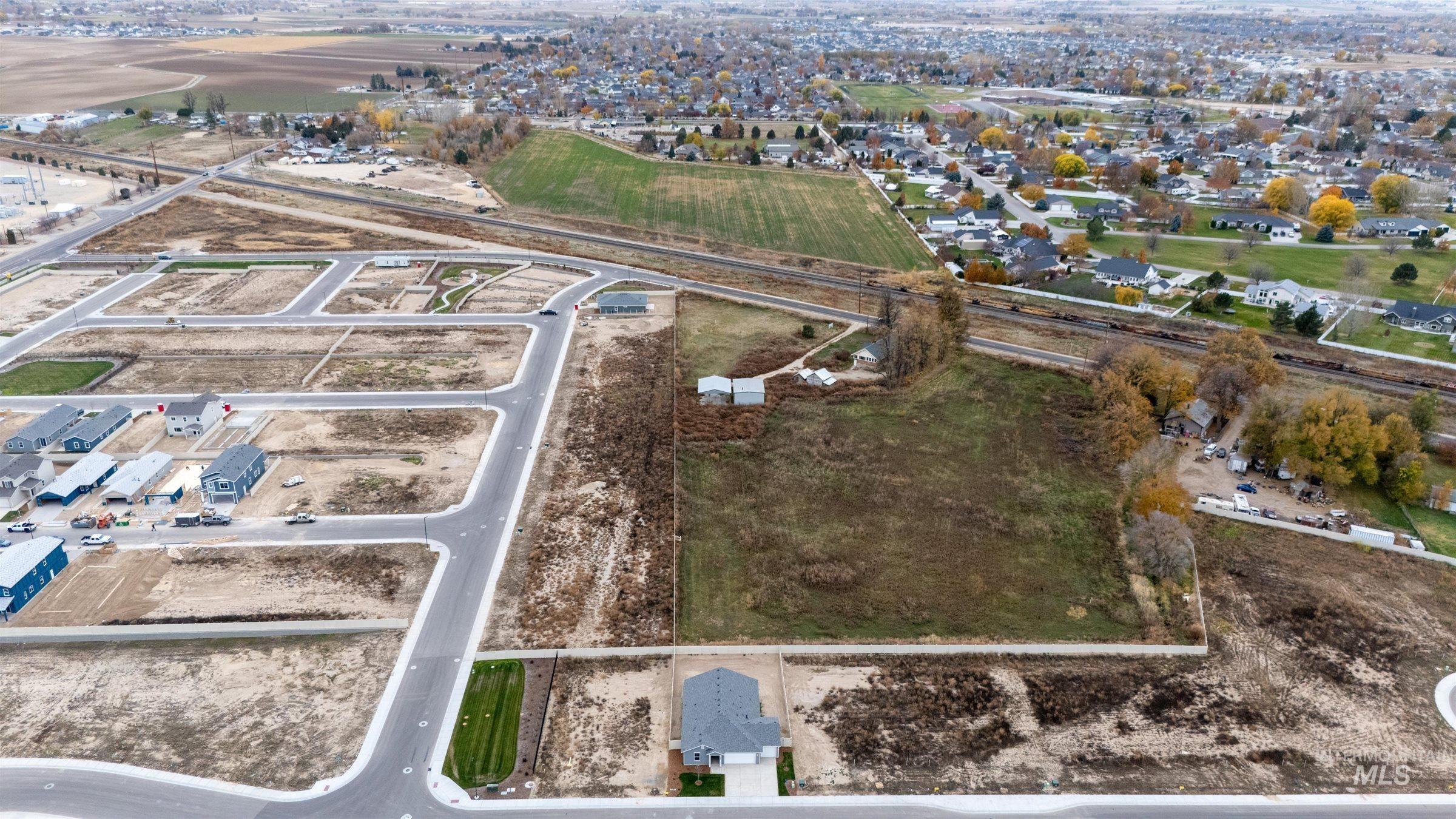 Aerial view of property's location featuring nearby suburban area