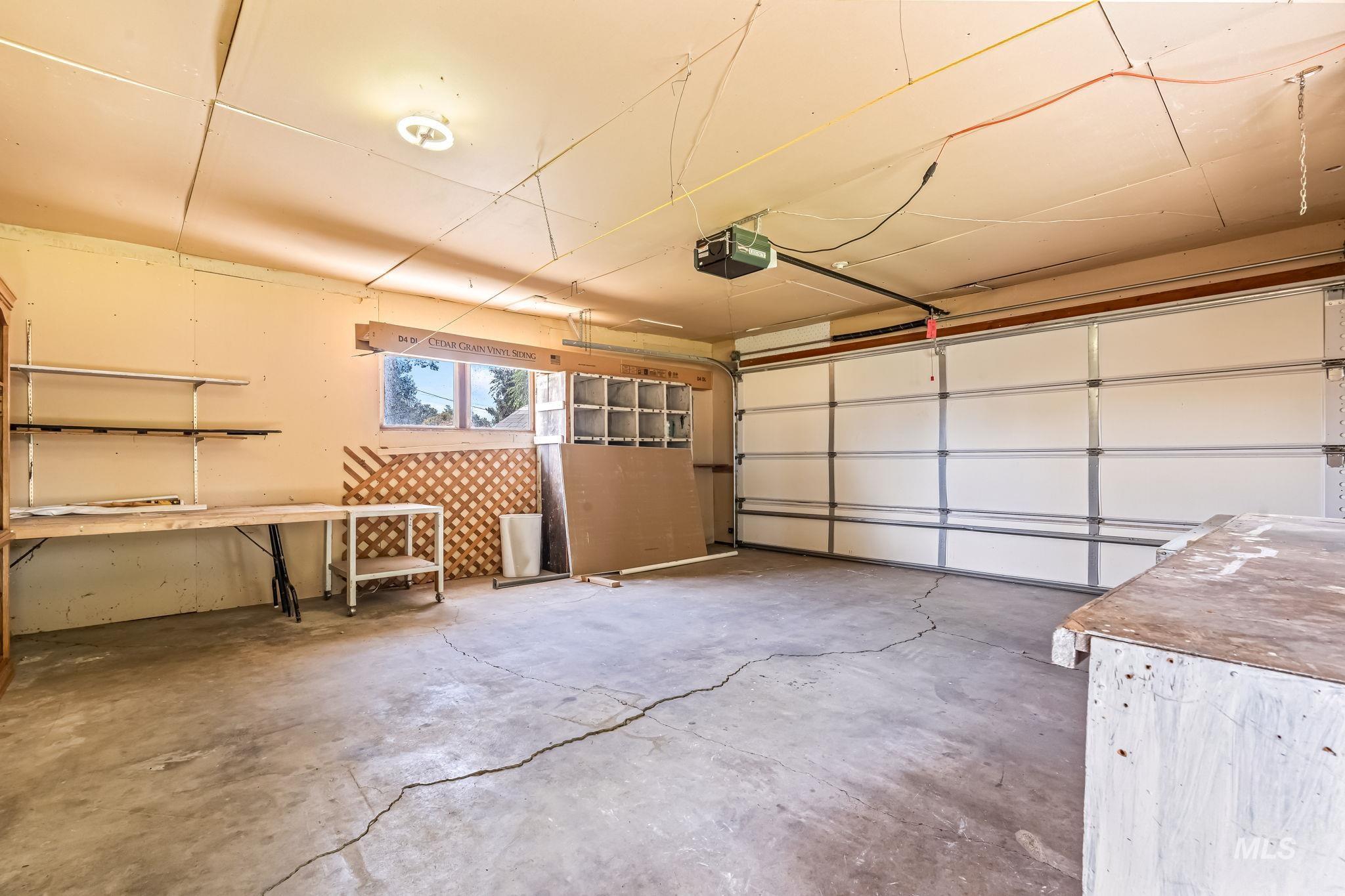 Garage featuring a garage door opener