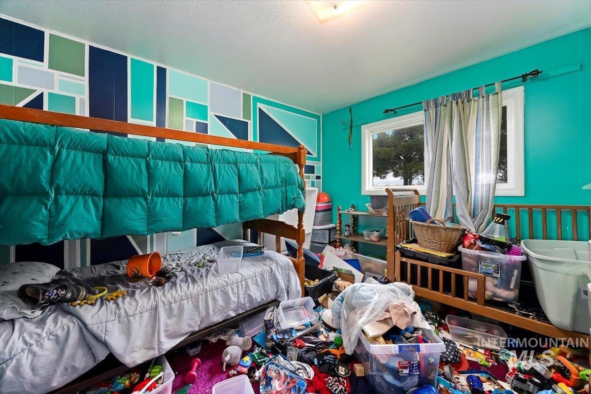 Bedroom with a textured ceiling