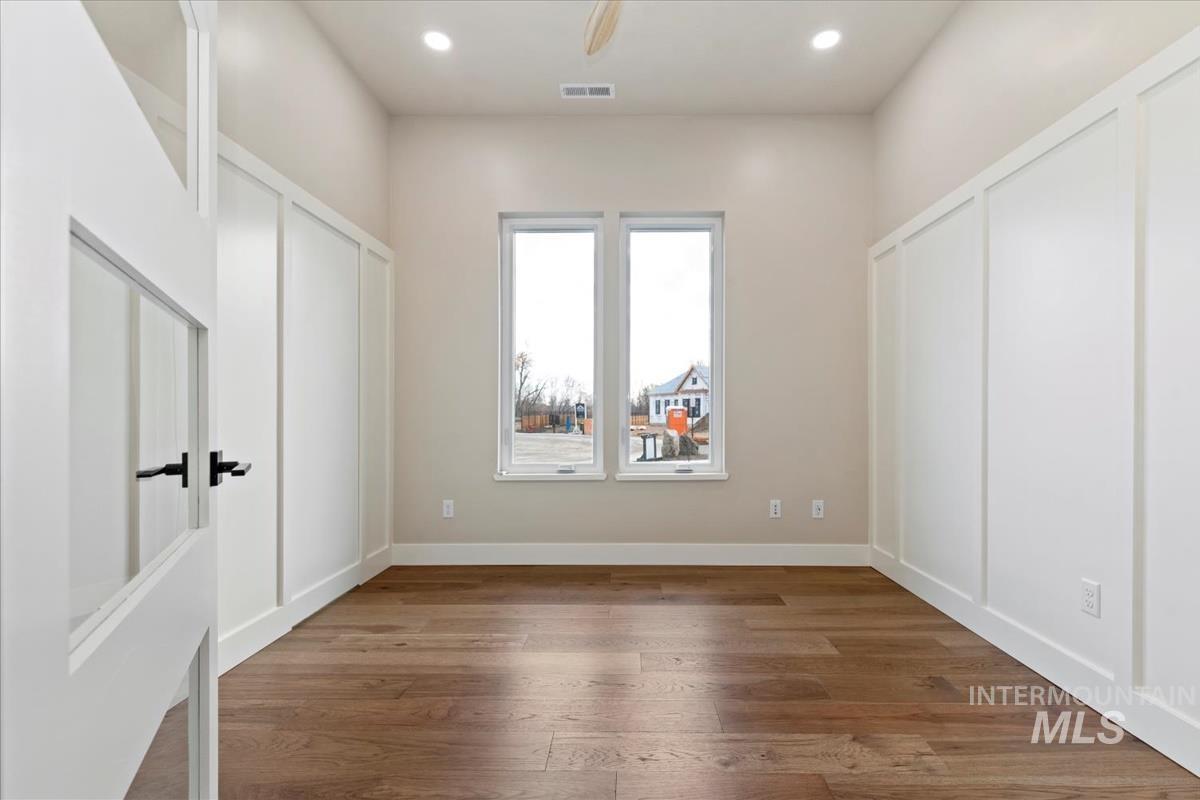 Unfurnished bedroom featuring wood finished floors, recessed lighting, and ceiling fan