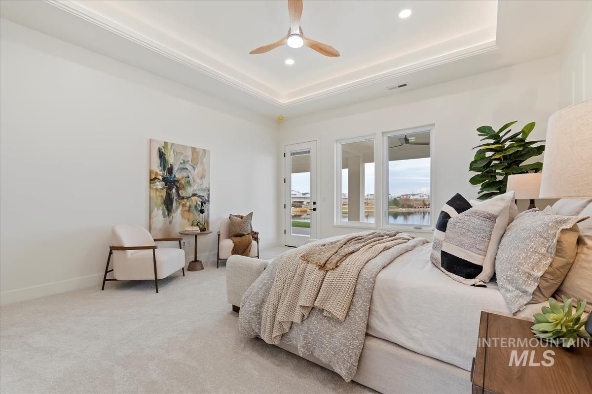 Bedroom with carpet, access to outside, ceiling fan, a water view, and recessed lighting