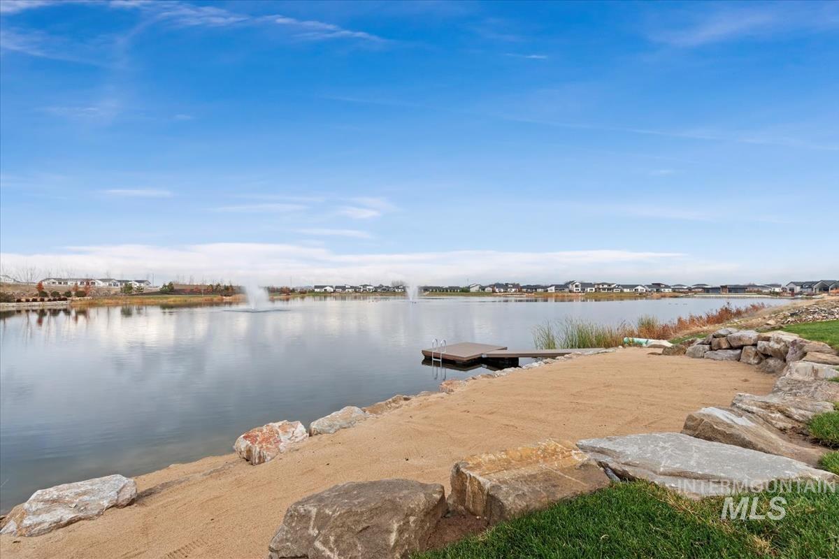 Dock area featuring a water view