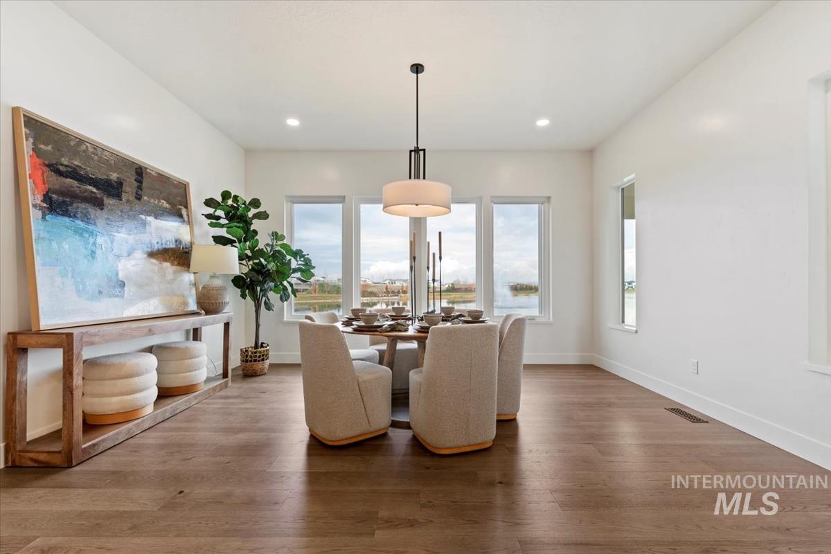 Dining space featuring light wood-style flooring and recessed lighting