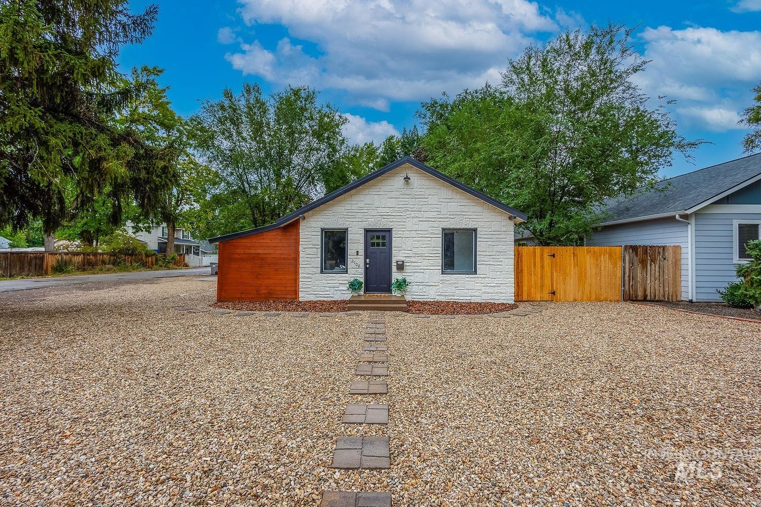 View of front of house featuring stone siding