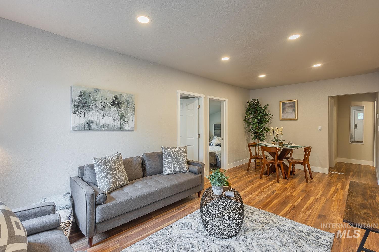 Living area with recessed lighting and wood finished floors