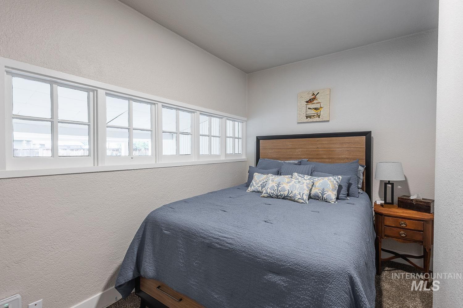 Bedroom with a textured wall