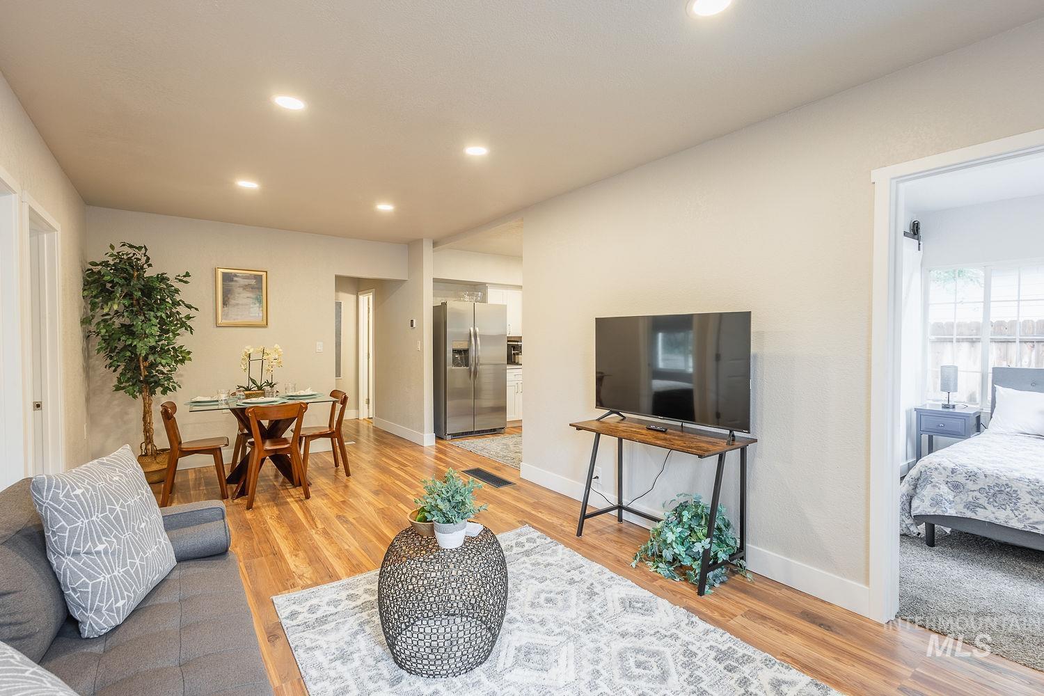 Living room featuring recessed lighting and light wood-style floors