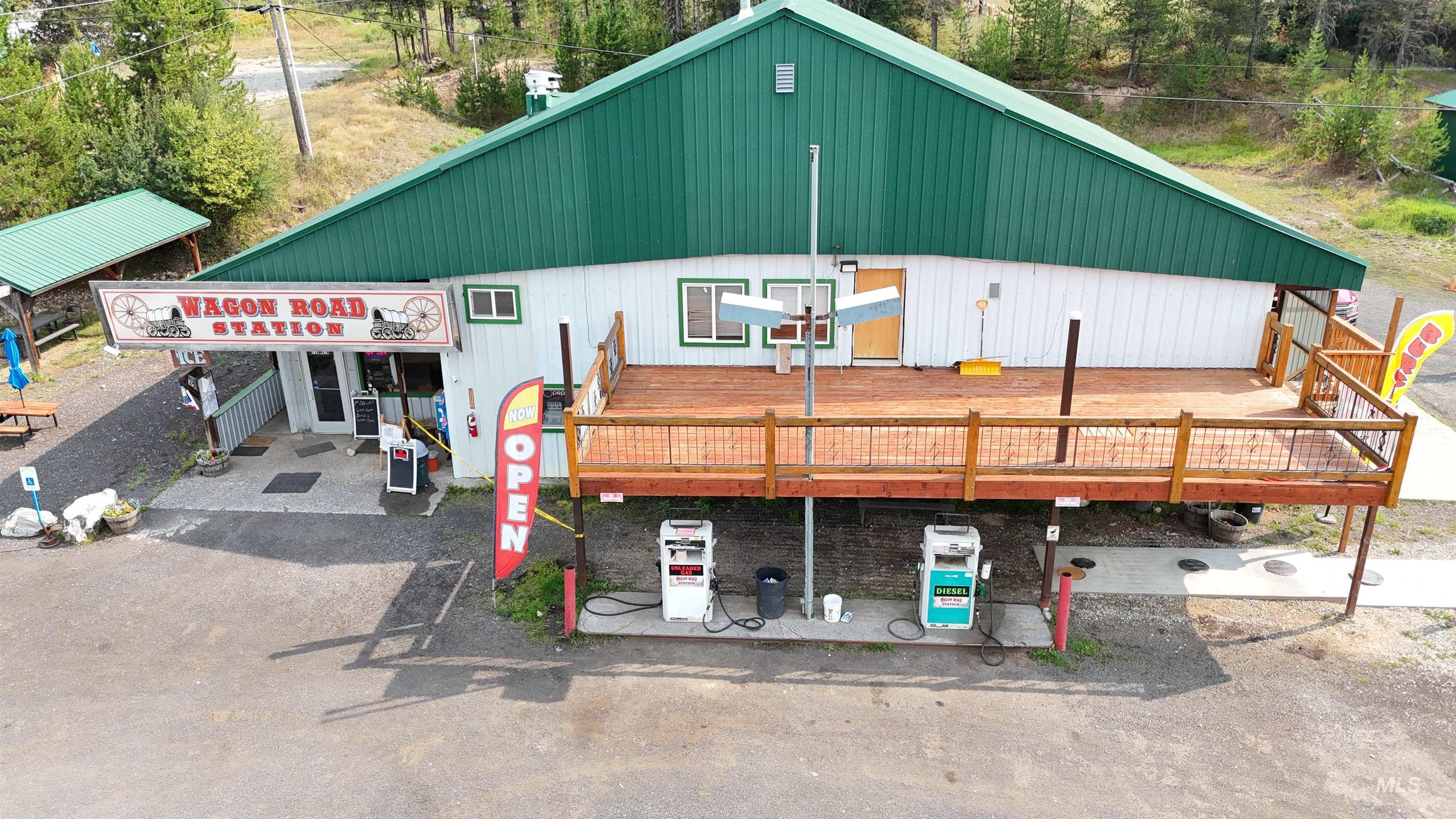 View of front of house with a wooden deck