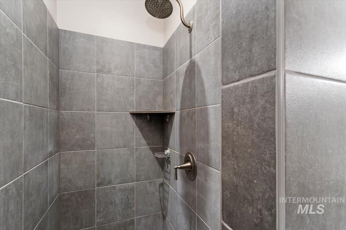 Bathroom view of a tile shower
