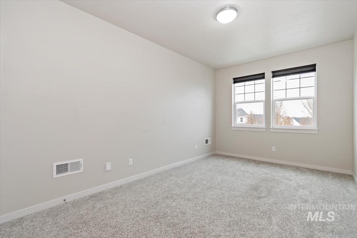 Empty room featuring carpet flooring