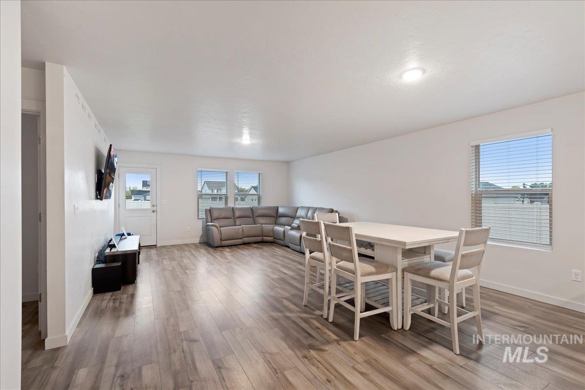 Dining area featuring light wood-style flooring and healthy amount of natural light