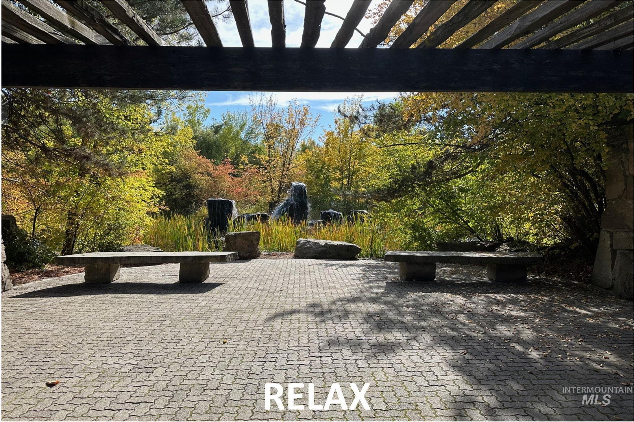 View of park with a pergola and a patio