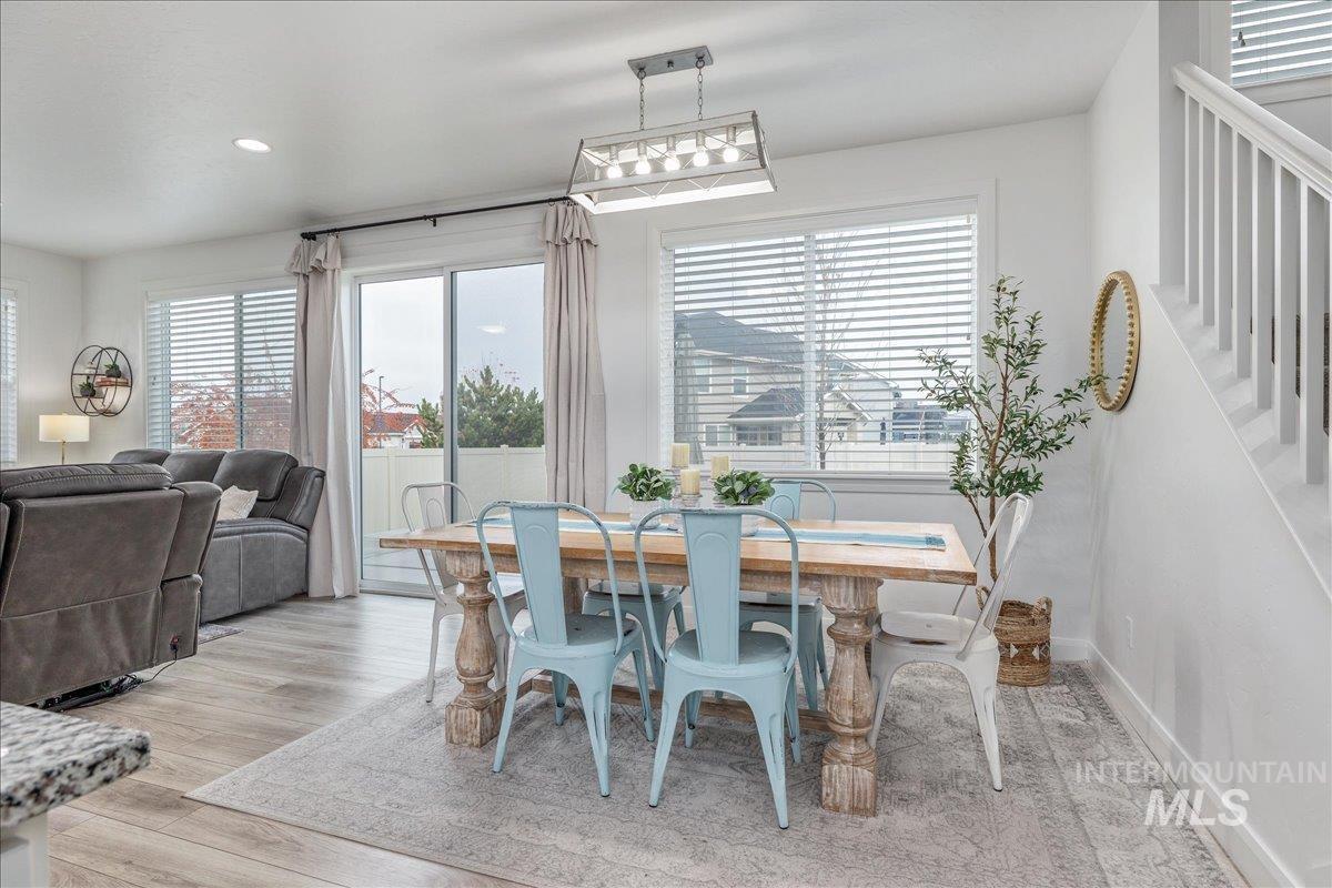 Dining space featuring light wood-style flooring and recessed lighting