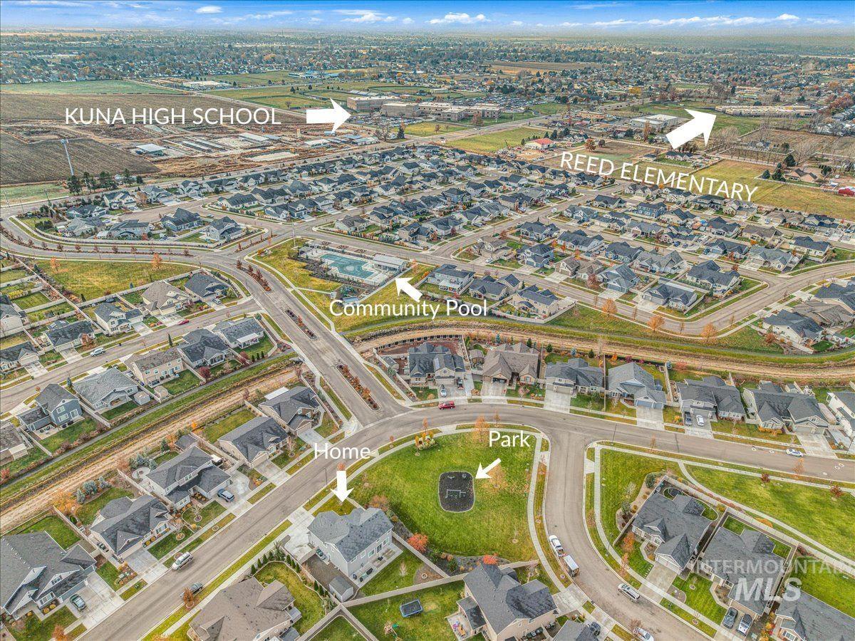 Aerial view of property's location with nearby suburban area
