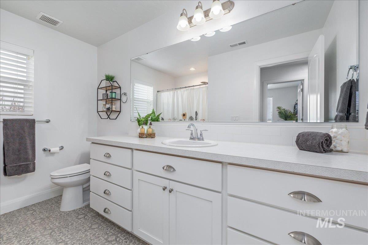 Bathroom featuring vanity and a shower with shower curtain