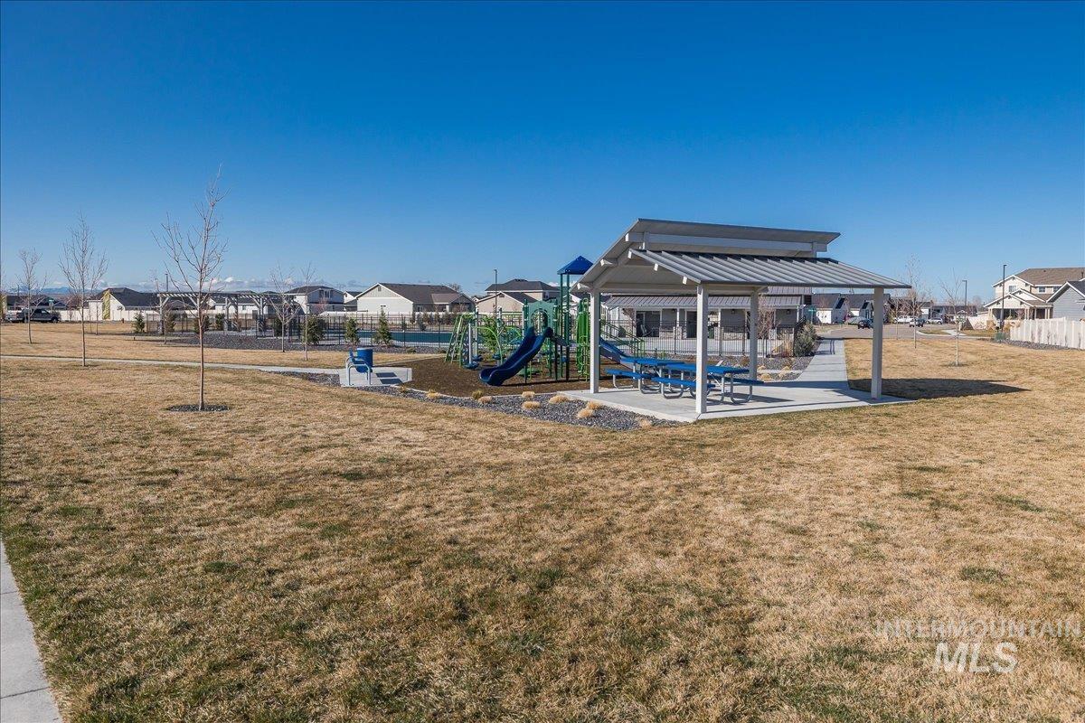 View of yard featuring a patio area and a residential view