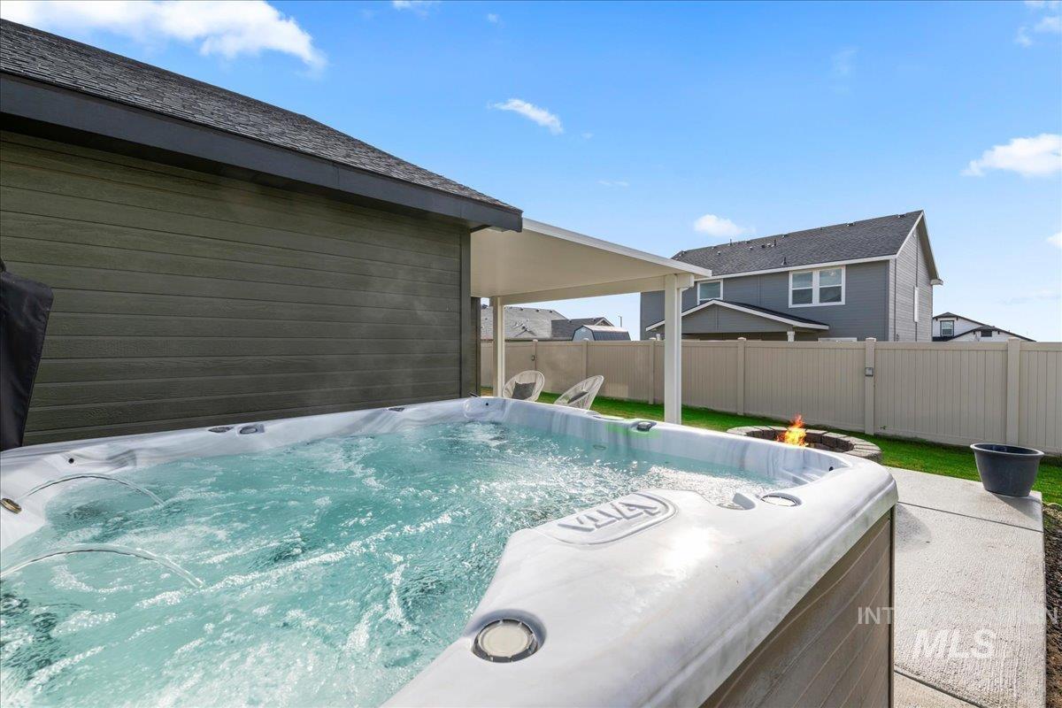 View of patio featuring a hot tub