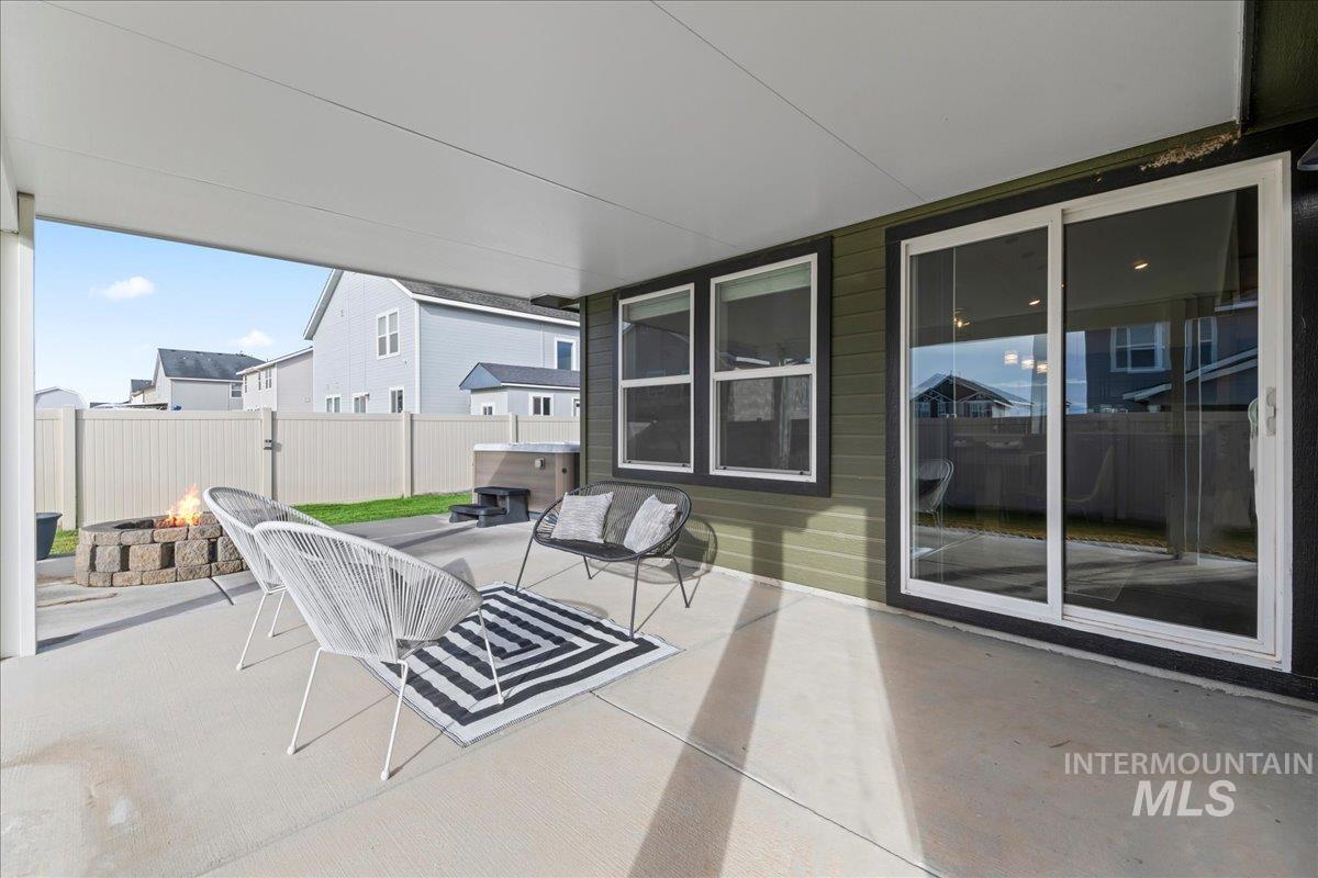 View of patio / terrace with an outdoor fire pit