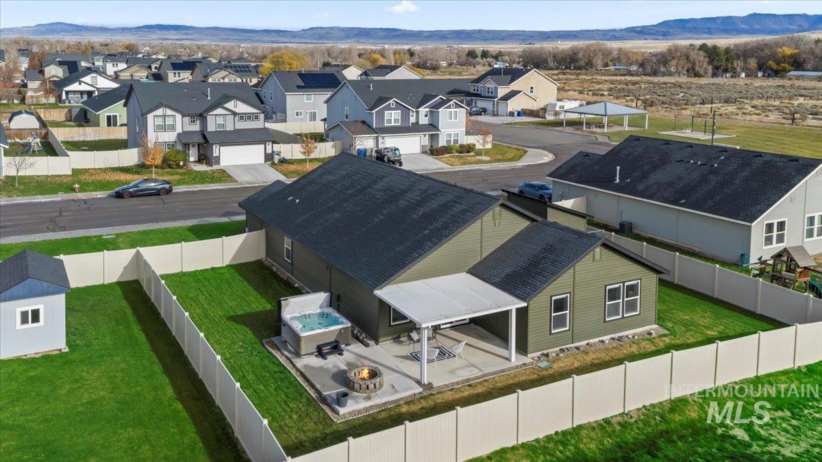Aerial view of residential area featuring mountains