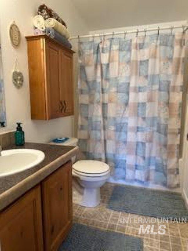 Bathroom featuring vanity and a shower with curtain