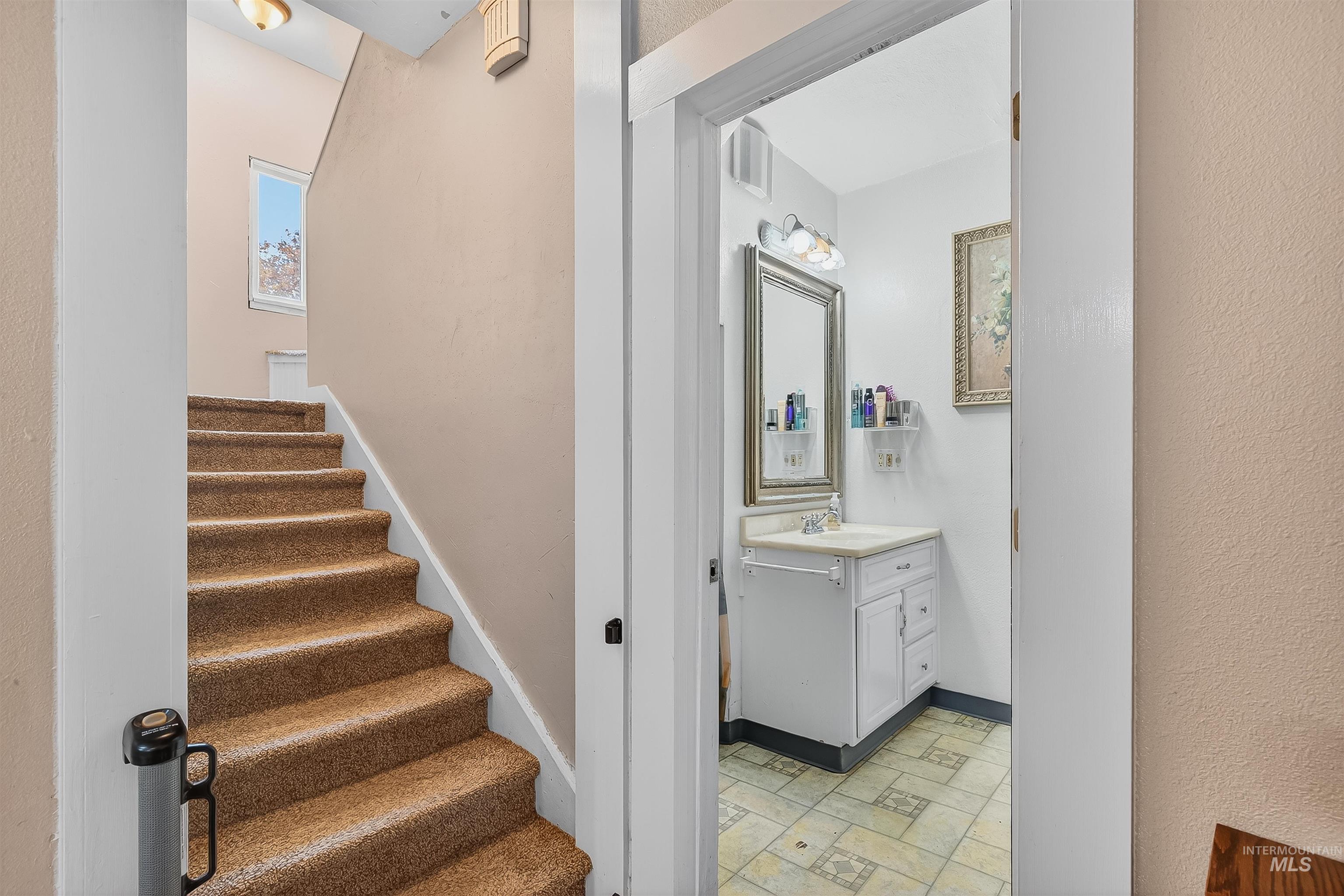 Stairs featuring baseboards