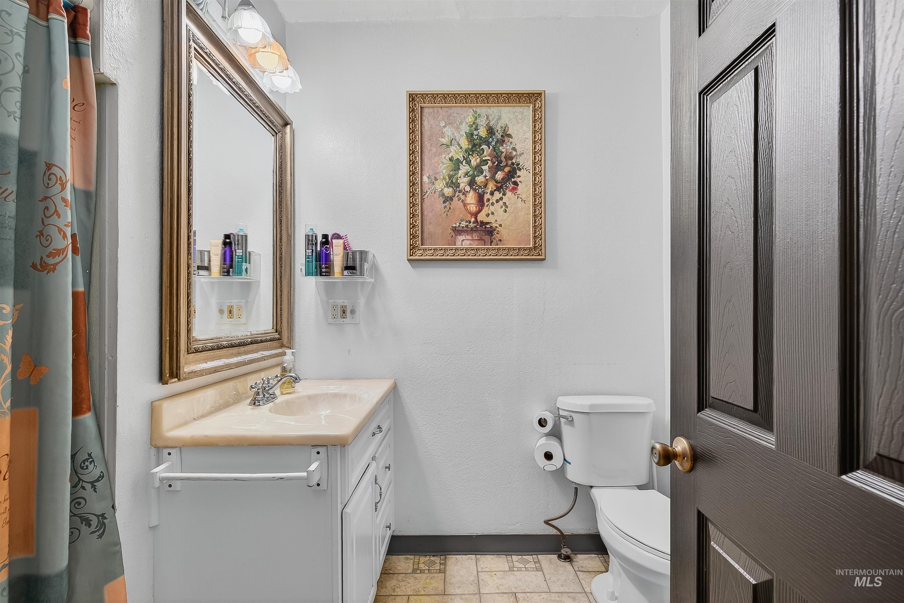 Bathroom with baseboards and vanity