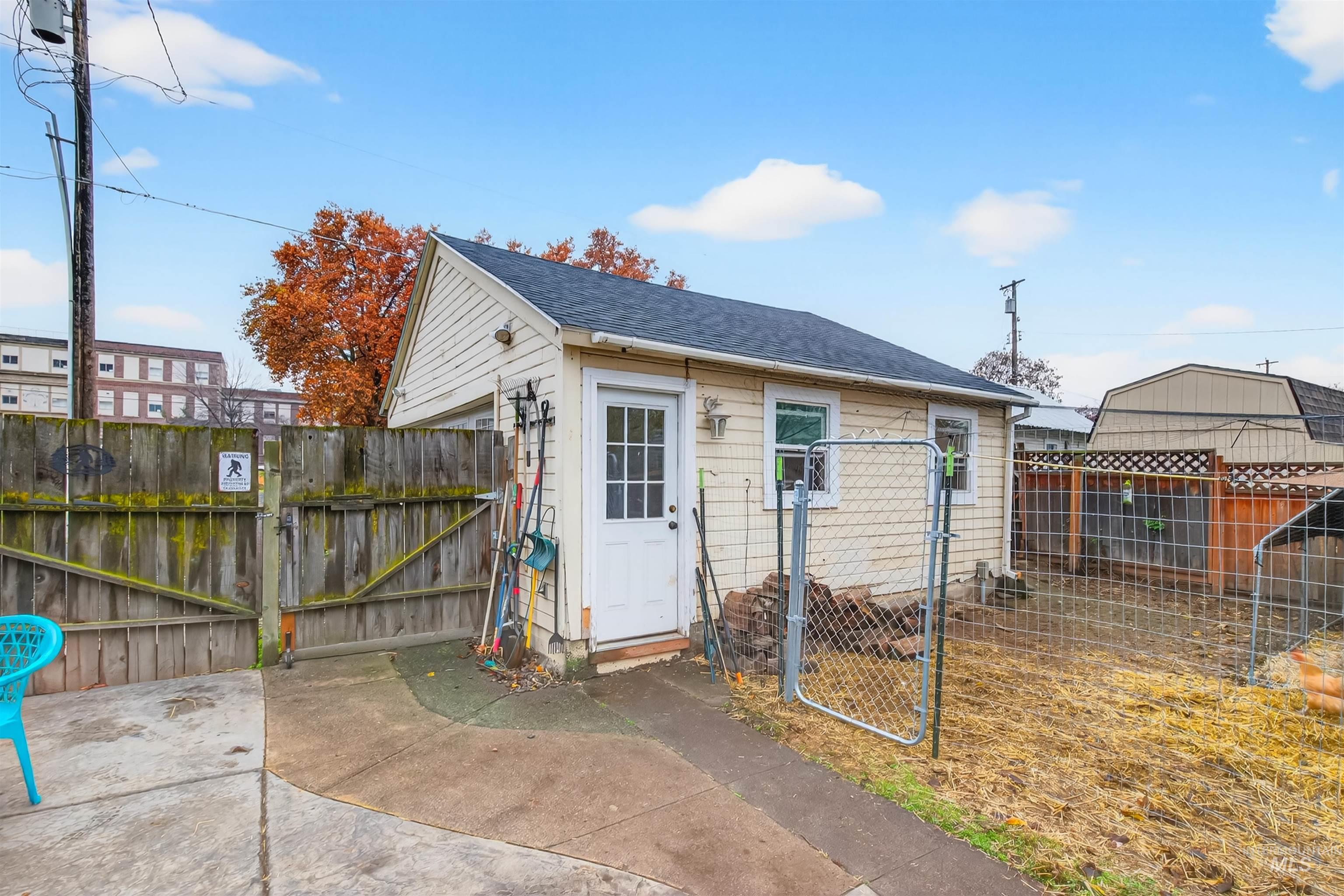 View of outdoor structure featuring a gate