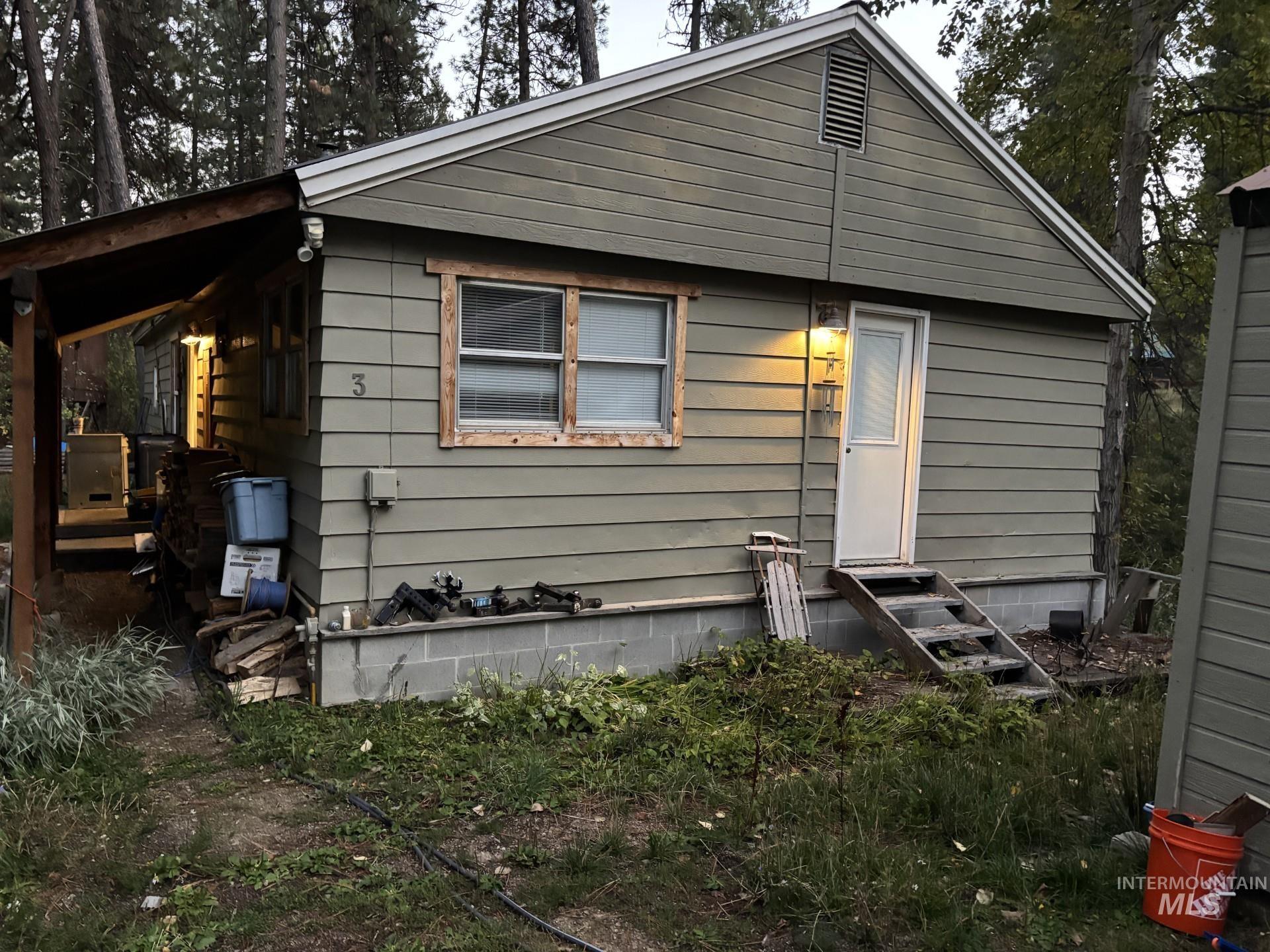 Rear view of property featuring entry steps