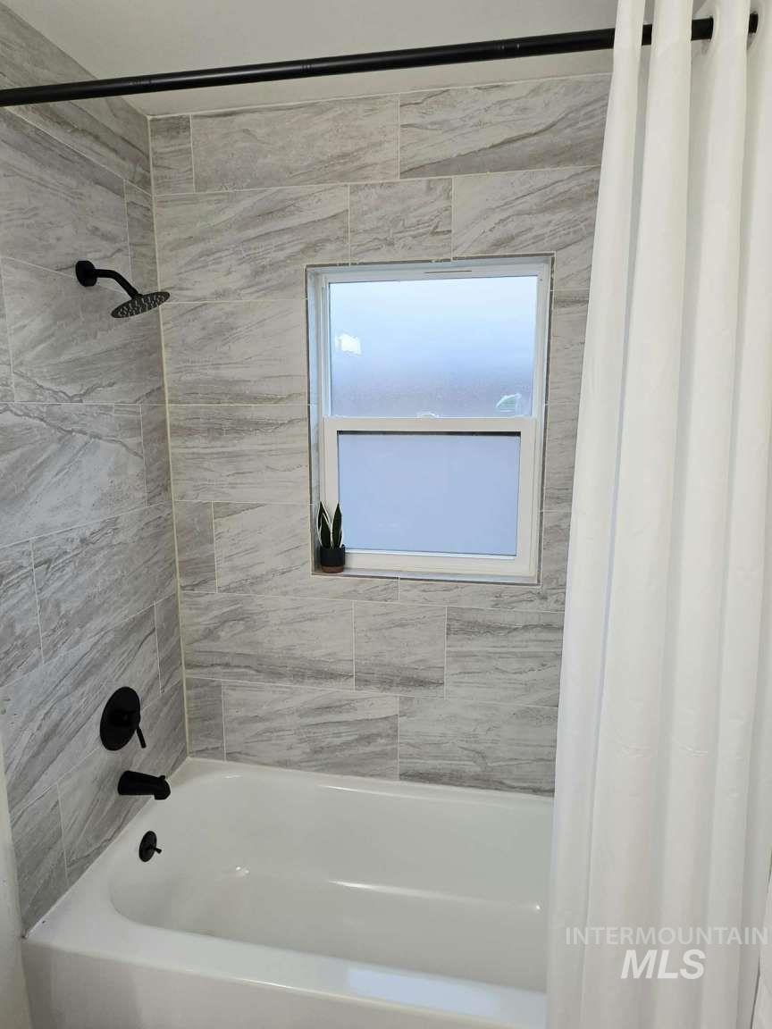 Bathroom featuring shower / tub combo