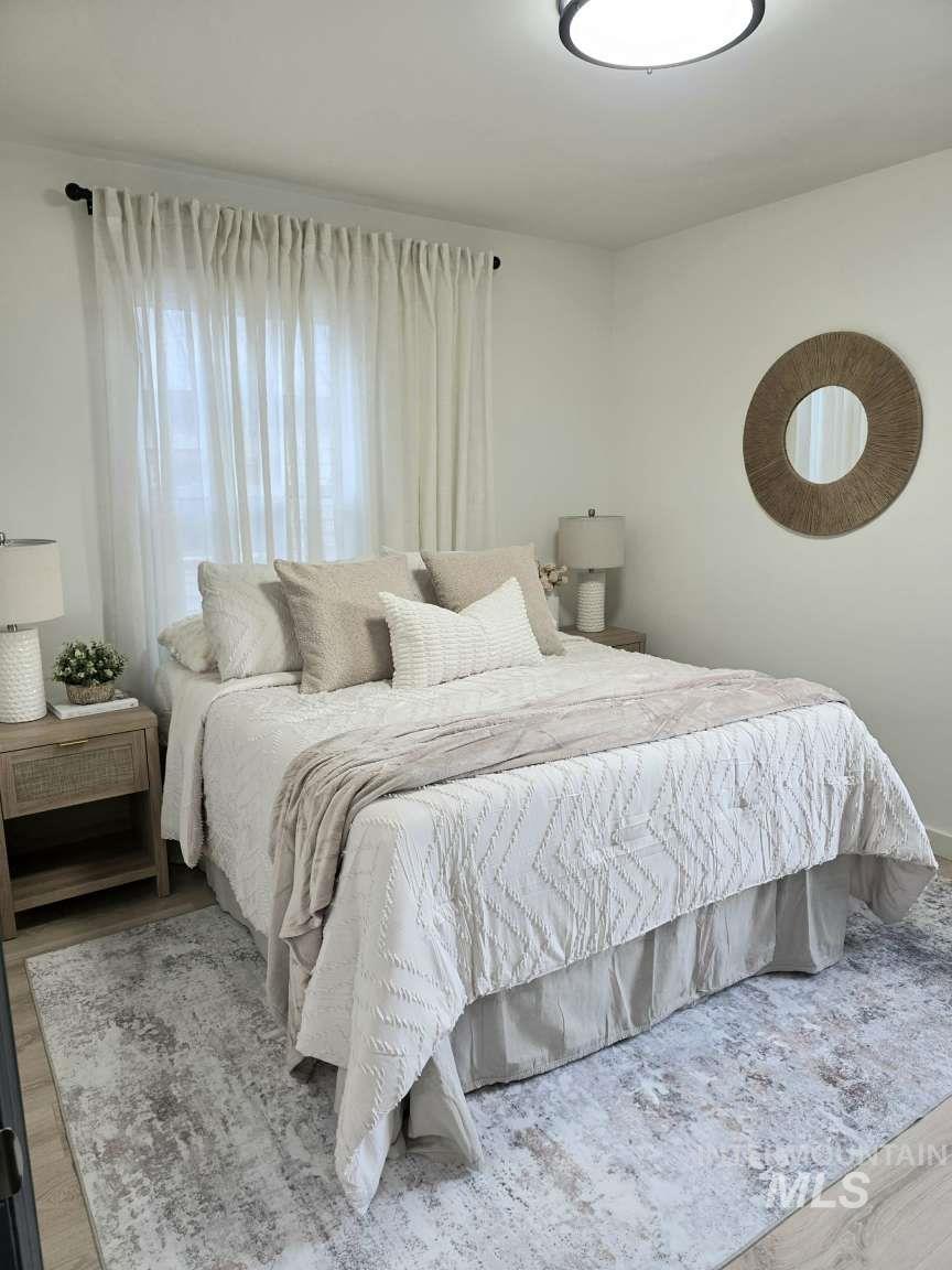 Bedroom featuring wood finished floors