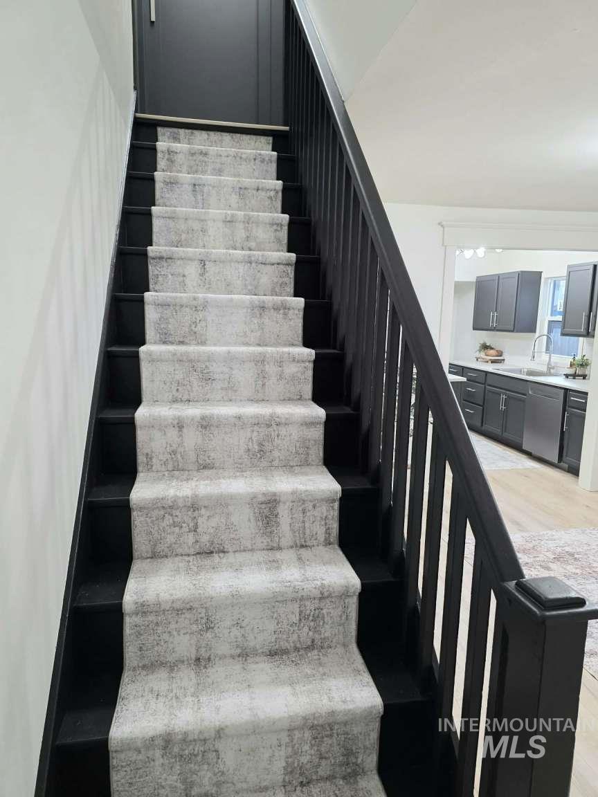 Stairway with wood finished floors