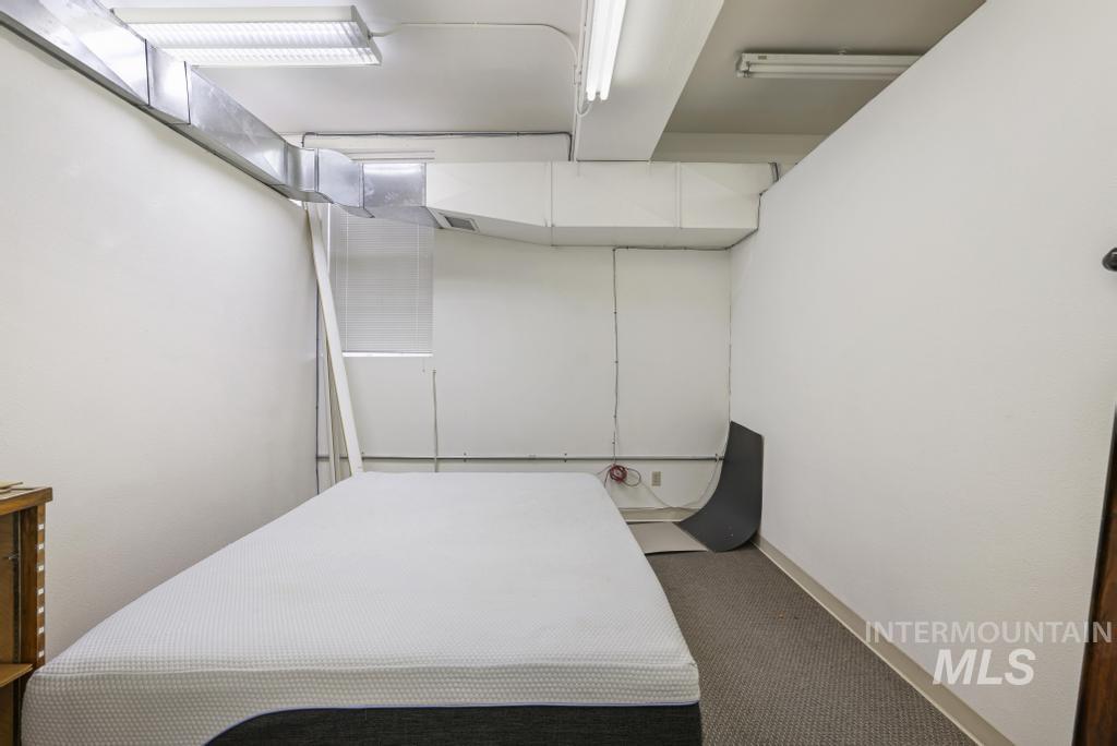 Bedroom with carpet and baseboards