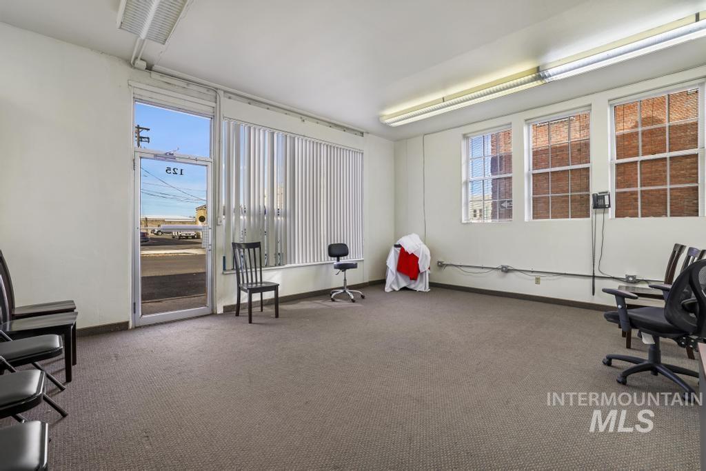 Sitting room featuring plenty of natural light