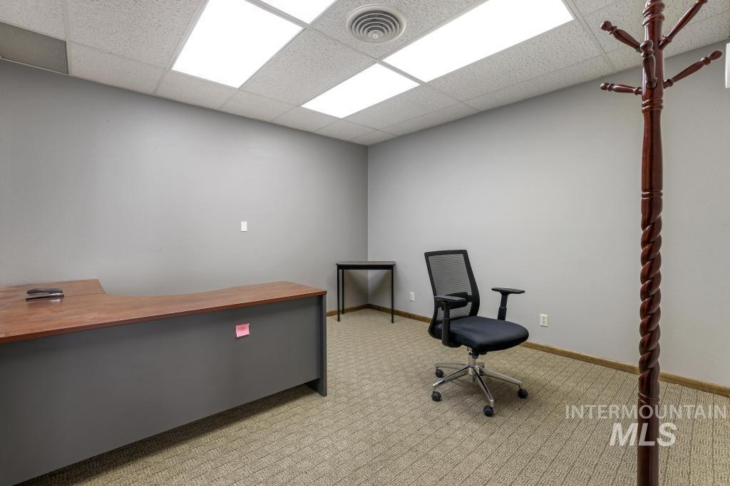 Unfurnished office featuring a paneled ceiling