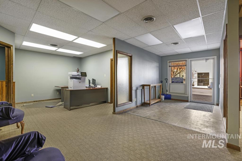 Office featuring a drop ceiling
