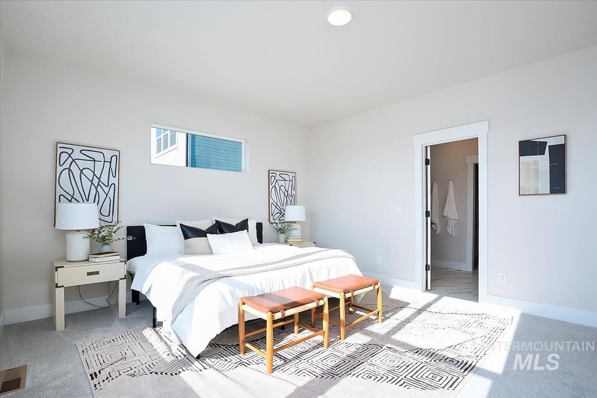Bedroom with carpet and baseboards