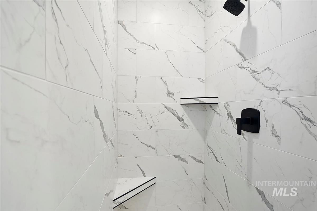 Bathroom view of a marble finish shower